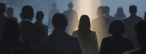 backs of people captured with ray of light shining